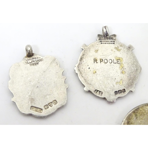 648 - An assortment of early 20thC hallmarked silver fob medals, each obverse with enamelled insignia, the... 