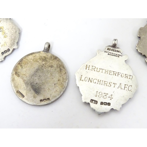 648 - An assortment of early 20thC hallmarked silver fob medals, each obverse with enamelled insignia, the... 