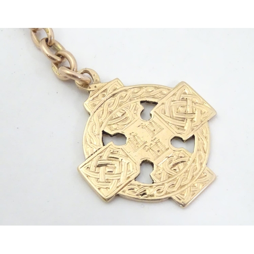 652 - Irish Hurling winner's gold medal: an early 20thC 9ct gold medal formed as a celtic ringed cross, th... 