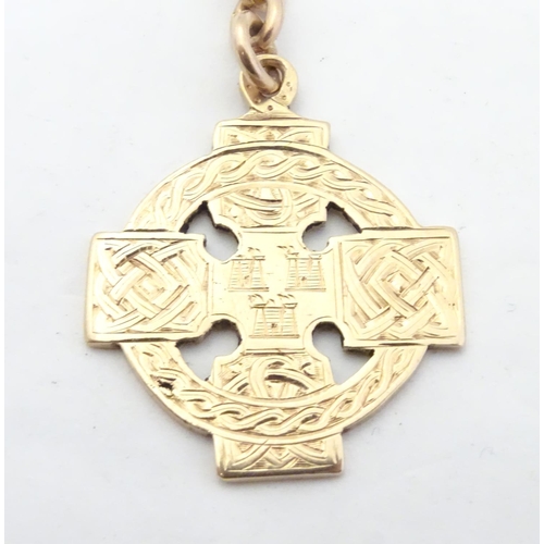 652 - Irish Hurling winner's gold medal: an early 20thC 9ct gold medal formed as a celtic ringed cross, th... 