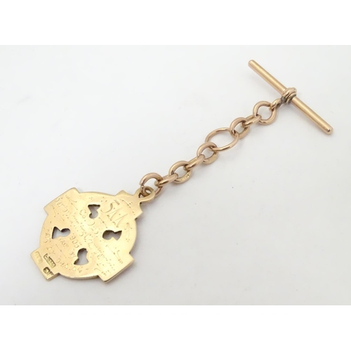 652 - Irish Hurling winner's gold medal: an early 20thC 9ct gold medal formed as a celtic ringed cross, th... 