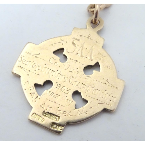 652 - Irish Hurling winner's gold medal: an early 20thC 9ct gold medal formed as a celtic ringed cross, th... 