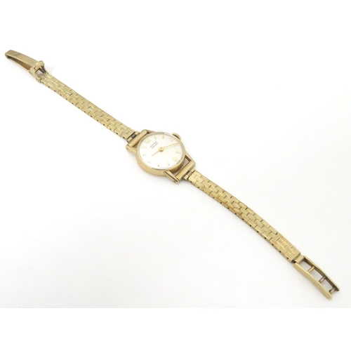 654 - A mid 20thC Vertex Revue 9ct gold ladies' watch, cased, the face measuring 3/4