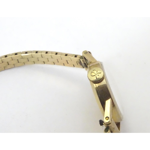 654 - A mid 20thC Vertex Revue 9ct gold ladies' watch, cased, the face measuring 3/4