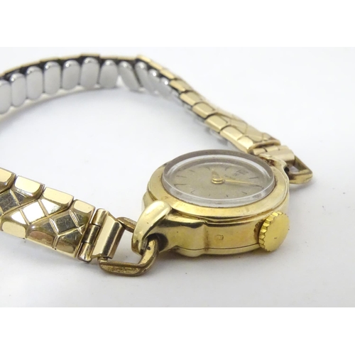 657 - Assorted ladies watches to include: 
A mid 20thC Tudor 9ct gold cased watch, together with two 9ct g... 