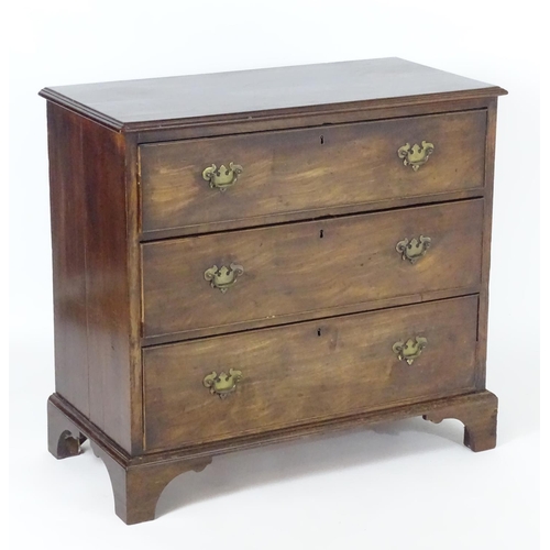 1382 - A late 18thC / early 19thC mahogany chest of drawers with a moulded rectangular top above three long... 