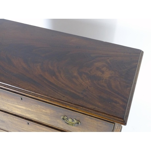 1382 - A late 18thC / early 19thC mahogany chest of drawers with a moulded rectangular top above three long... 