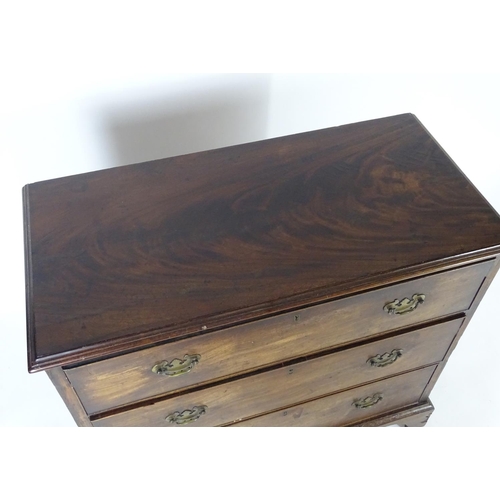 1382 - A late 18thC / early 19thC mahogany chest of drawers with a moulded rectangular top above three long... 