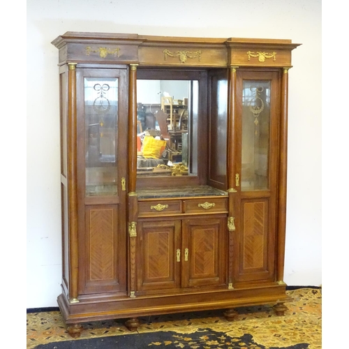 1385 - A mid 20thC continental mahogany cabinet having a recessed mirror back with grey marble top over two... 