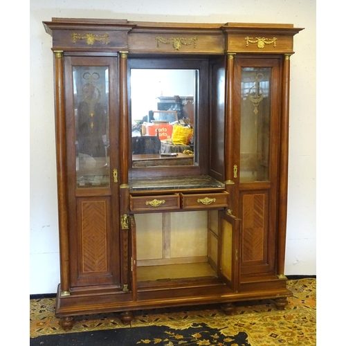 1385 - A mid 20thC continental mahogany cabinet having a recessed mirror back with grey marble top over two... 