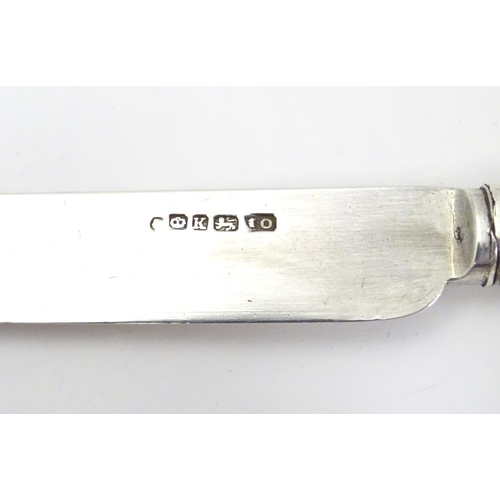 473 - A butter knife with silver blade hallmarked Sheffield 1853 maker John Oxley together with a silver p... 