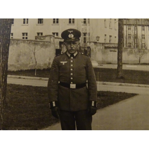 672 - Militaria: a WWII/WW2/Second World War German photograph album, the cover with Reichsadler, titled '... 