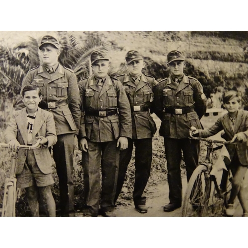 672 - Militaria: a WWII/WW2/Second World War German photograph album, the cover with Reichsadler, titled '... 