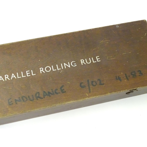 676 - Militaria: a mid to late 20thC cased naval navigational parallel rolling rule, the case marked 'Endu... 