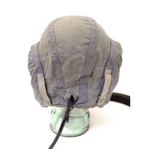 679 - Militaria: a 1960s Royal Air Force issue Type G flying helmet, blue airtex fabric with headphones an... 