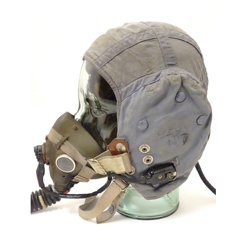 679 - Militaria: a 1960s Royal Air Force issue Type G flying helmet, blue airtex fabric with headphones an... 