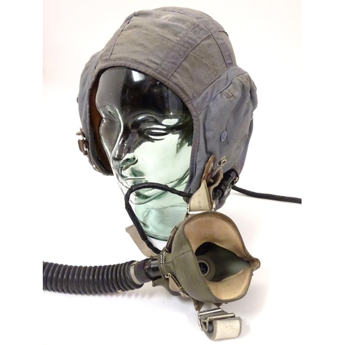 679 - Militaria: a 1960s Royal Air Force issue Type G flying helmet, blue airtex fabric with headphones an... 