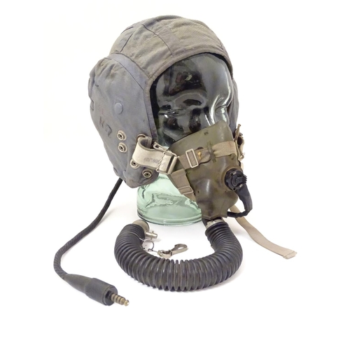 679 - Militaria: a 1960s Royal Air Force issue Type G flying helmet, blue airtex fabric with headphones an... 