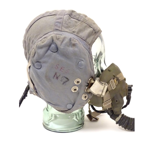 679 - Militaria: a 1960s Royal Air Force issue Type G flying helmet, blue airtex fabric with headphones an... 