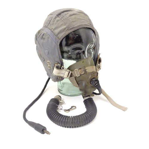 679 - Militaria: a 1960s Royal Air Force issue Type G flying helmet, blue airtex fabric with headphones an... 