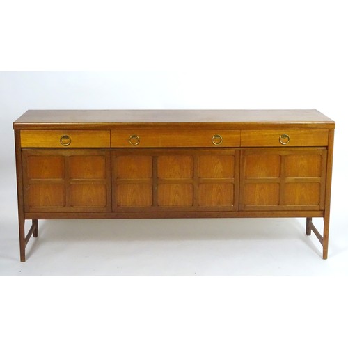 1566 - Vintage retro, mid-century: a 1970s teak sideboard by Nathan Furniture, composed of three cupboards ... 