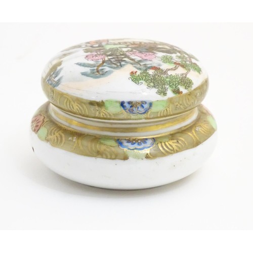 28 - A Japanese Noritake circular pot and cover with hand painted decoration depicting a Geisha girl in a... 