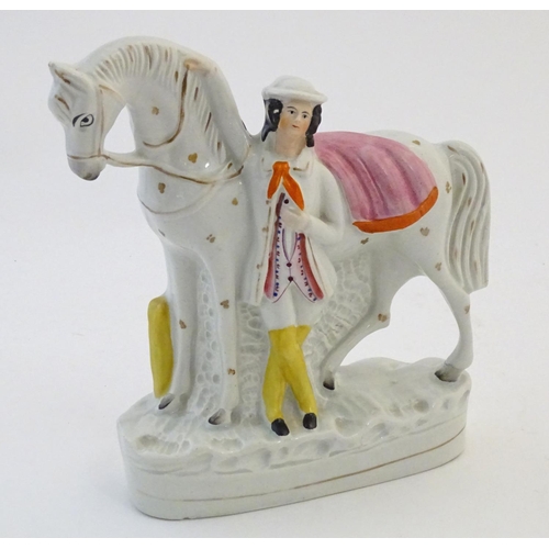 51 - A Staffordshire pottery flat back model depicting a man and a horse. Approx. 9