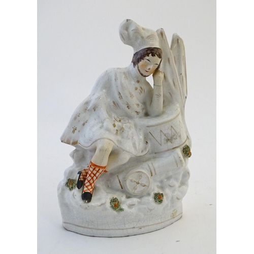 61 - A Staffordshire pottery flat back figure depicting a Scottish soldier resting on a drum with a canno... 