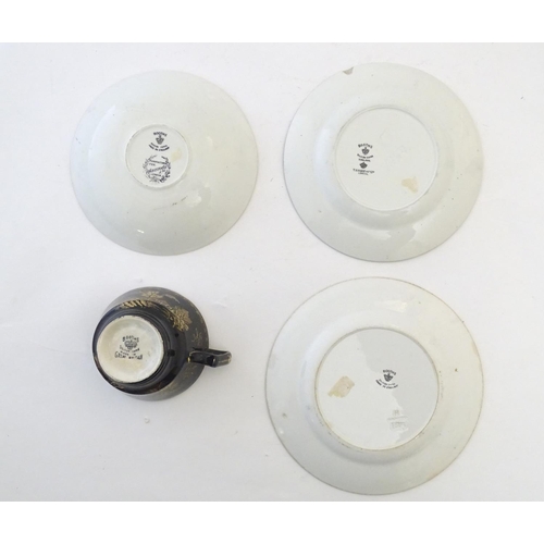273 - A Booths Silicon China tea cup and saucer, together with two small plates with a black ground and gi... 