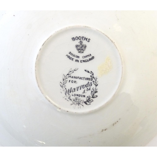 273 - A Booths Silicon China tea cup and saucer, together with two small plates with a black ground and gi... 
