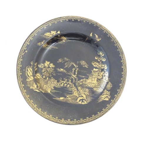273 - A Booths Silicon China tea cup and saucer, together with two small plates with a black ground and gi... 