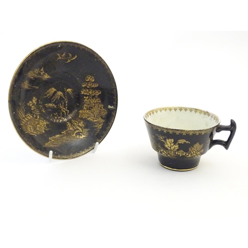 273 - A Booths Silicon China tea cup and saucer, together with two small plates with a black ground and gi... 