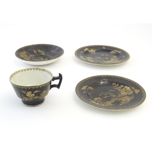 273 - A Booths Silicon China tea cup and saucer, together with two small plates with a black ground and gi... 