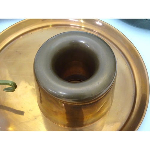 32 - A quantity of assorted metal ware to include copper pans, a pewter warmer, teapot etc.