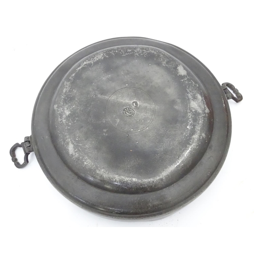 32 - A quantity of assorted metal ware to include copper pans, a pewter warmer, teapot etc.
