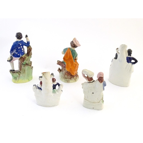 67 - Five assorted Staffordshire pottery figures comprising two models of shepherds and their sheep, two ... 