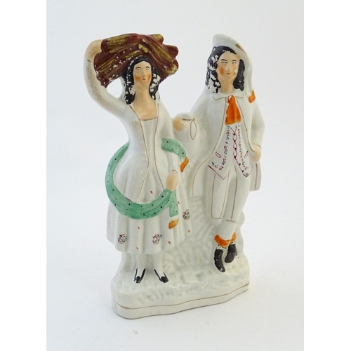 72 - A Staffordshire pottery flat back figural group depicting a harvest couple, the man carries a flagon... 