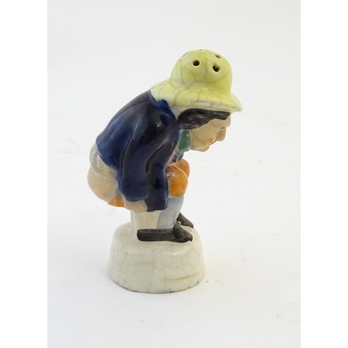 78 - An early 19thC Staffordshire comical / novelty pepper pot modelled as Roger Giles squatting. Approx.... 