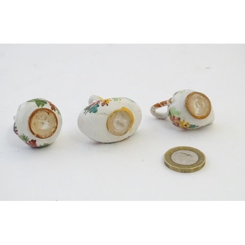 89 - Three Continental miniature baskets with hand painted floral decoration. Largest approx. 1 3/4