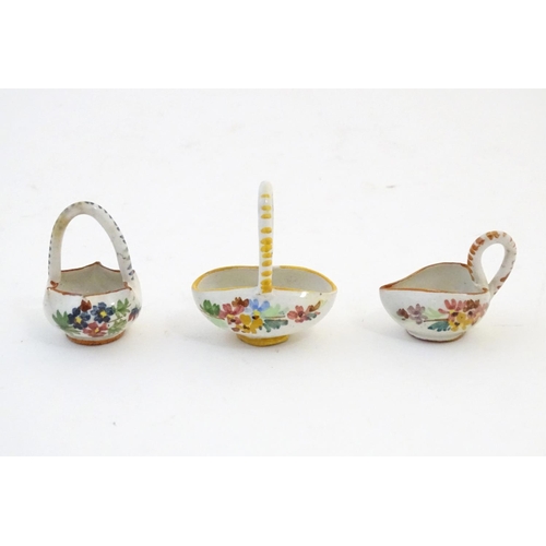 89 - Three Continental miniature baskets with hand painted floral decoration. Largest approx. 1 3/4