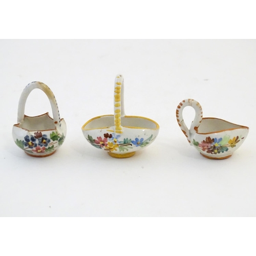 89 - Three Continental miniature baskets with hand painted floral decoration. Largest approx. 1 3/4