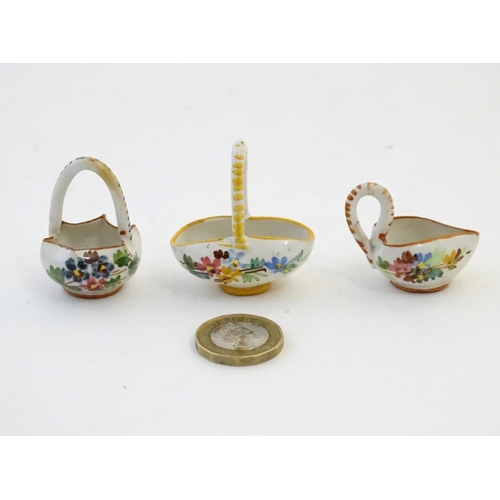 89 - Three Continental miniature baskets with hand painted floral decoration. Largest approx. 1 3/4