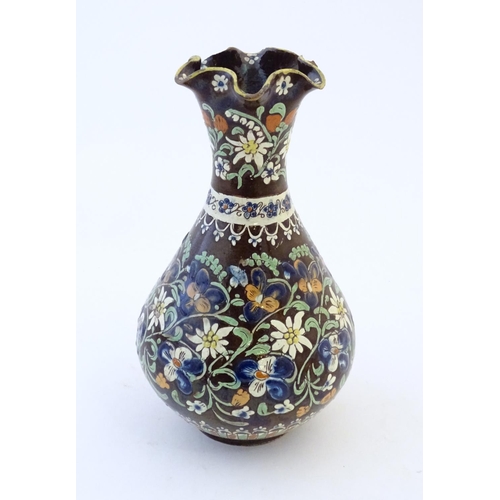 102 - A 19thC Swiss Thoune style vase with a fluted rim and flower decoration. Approx. 10 1/4