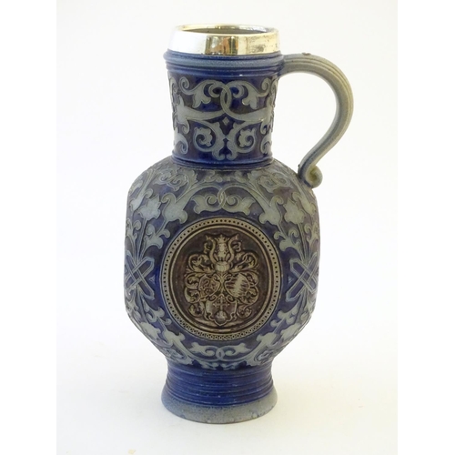 113 - A 19thC German salt glazed stoneware jug by Merkelbach & Wick, with a silver rim hallmarked Sheffiel... 