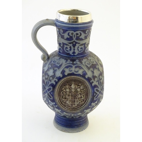 113 - A 19thC German salt glazed stoneware jug by Merkelbach & Wick, with a silver rim hallmarked Sheffiel... 