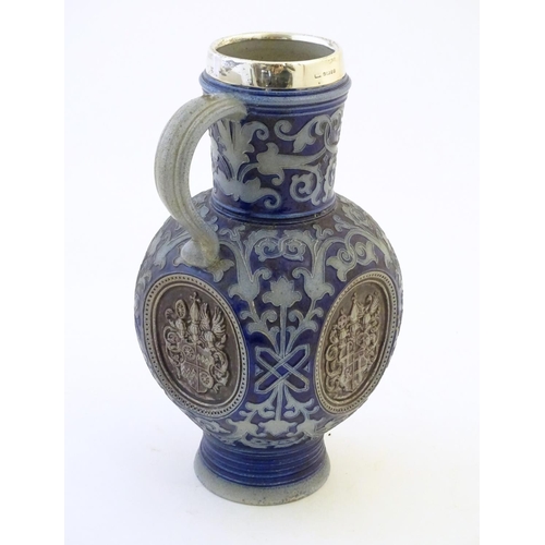 113 - A 19thC German salt glazed stoneware jug by Merkelbach & Wick, with a silver rim hallmarked Sheffiel... 