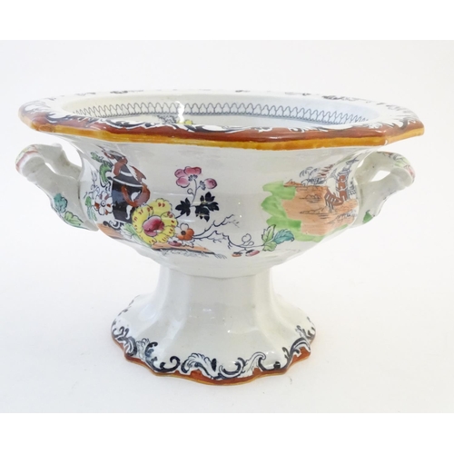 122 - A Masons Ironstone pedestal tureen with chinoiserie decoration depicting Oriental landscapes with pa... 