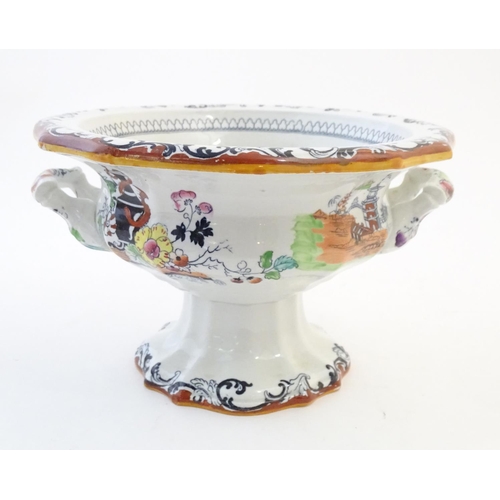 122 - A Masons Ironstone pedestal tureen with chinoiserie decoration depicting Oriental landscapes with pa... 