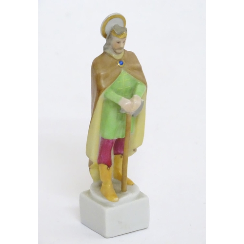 124 - A Herend pottery figure modelled as a Saint. Marked under. Approx. 4