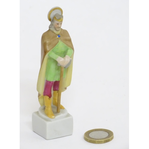 124 - A Herend pottery figure modelled as a Saint. Marked under. Approx. 4